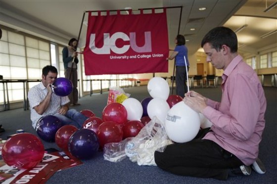Members of Britain's University and College Union (UCU) prepare for a union strike and march scheduled for Thursday.